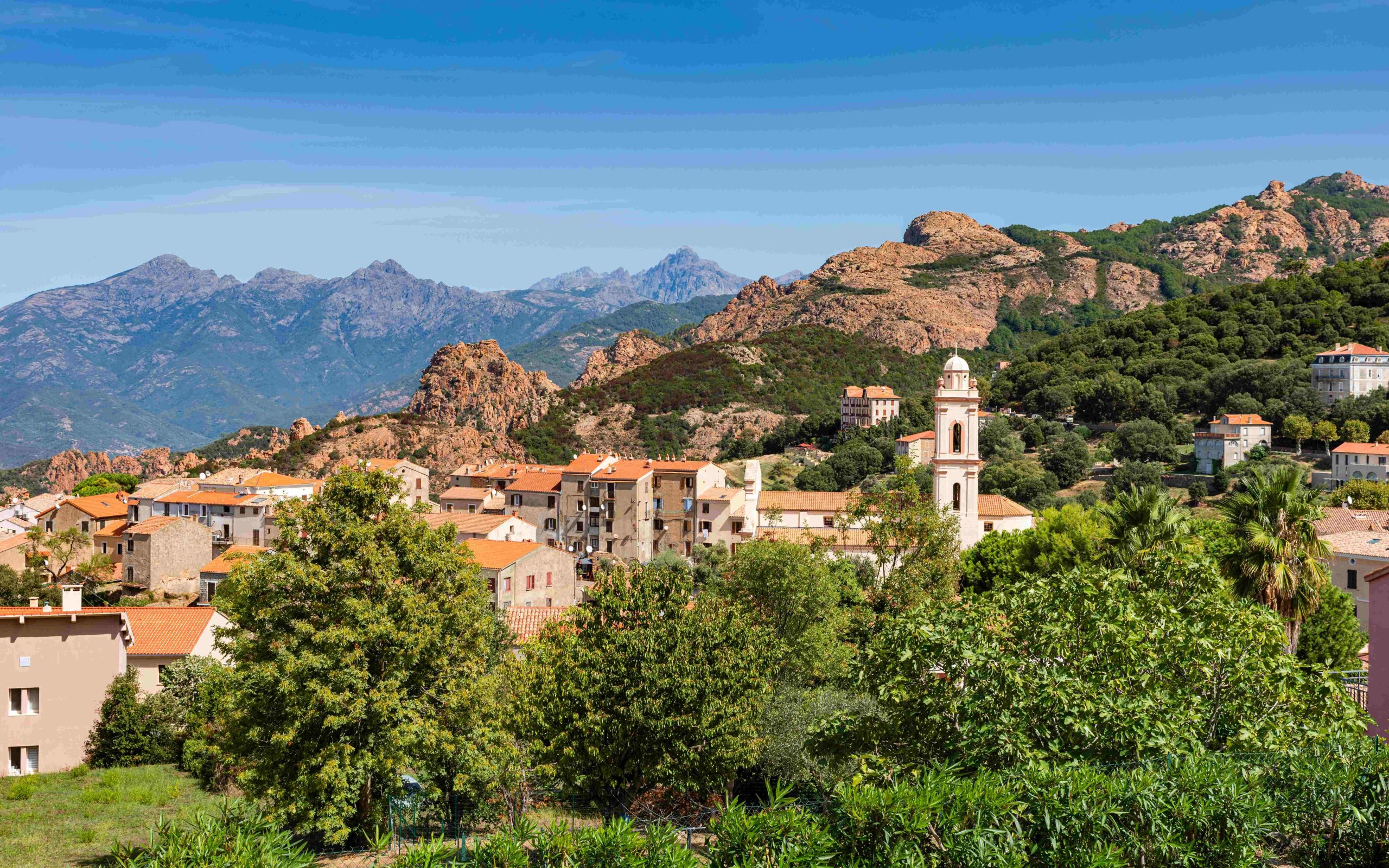 View-of-Piana-village-with-church-tower-in-mountain-landscape-of-western-Corsica-France-scaled